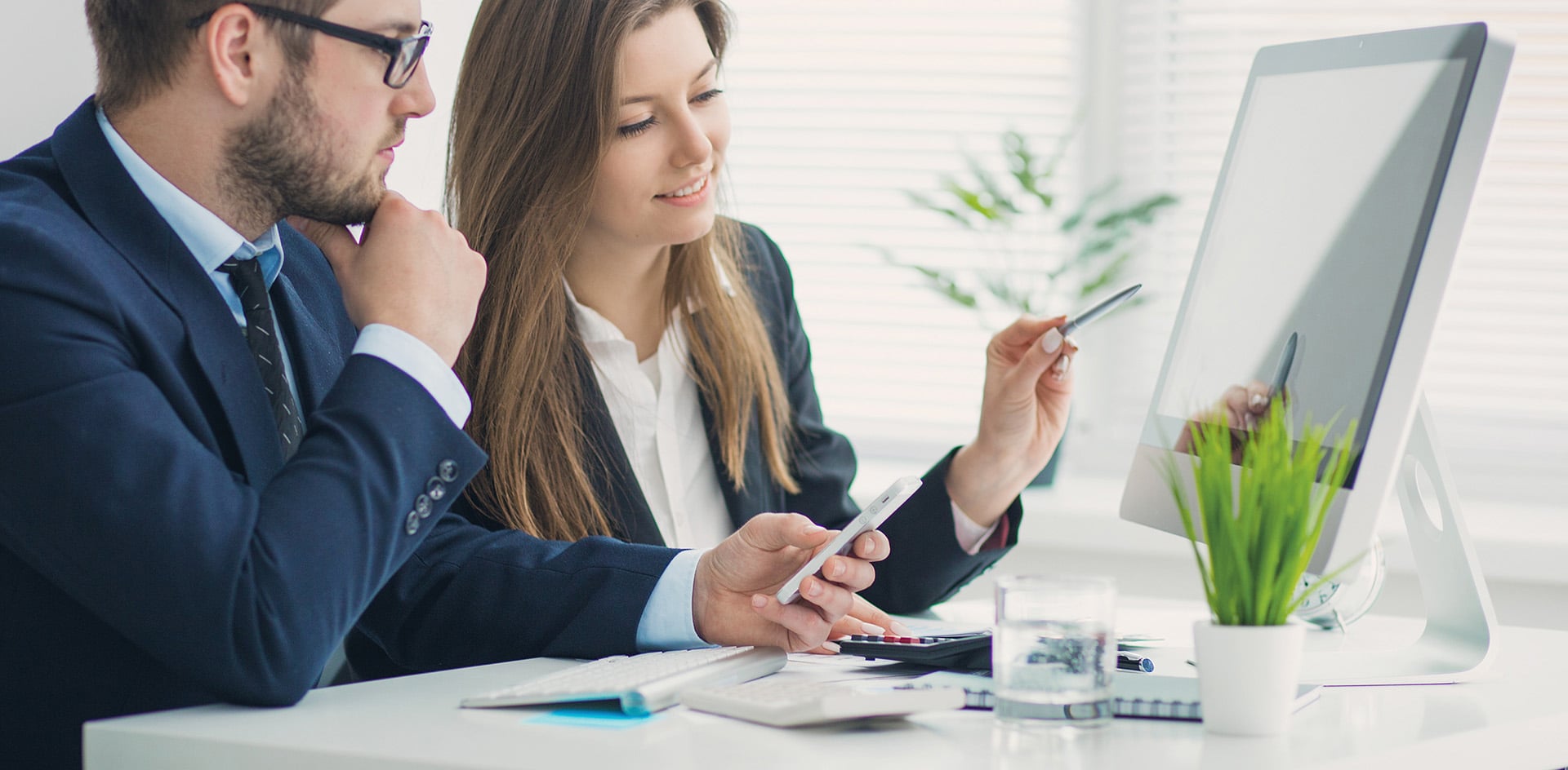 Young businessman discussing something with his colleague, and u